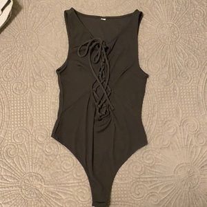 New- never worn thong body suits, lace up front